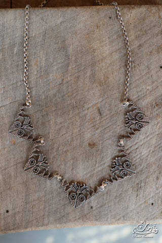 Amulet motifs necklace